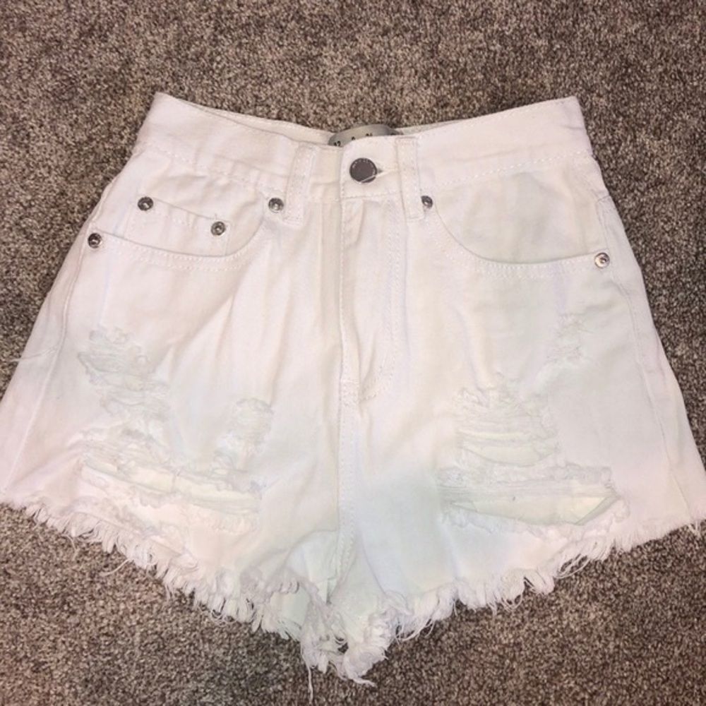 White ripped denim shorts